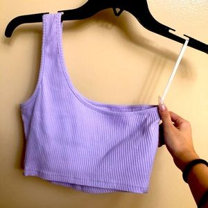 Small, lavender one shoulder crop top.